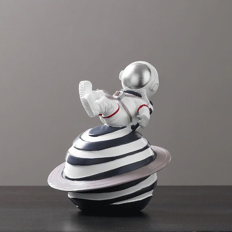 Figurine Astronaute sur Saturne Argenté